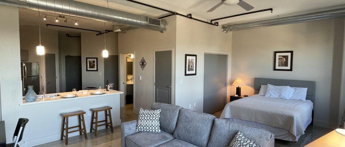 Bedroom, Living Room and Kitchen within San Antonio Corporate Housing Apartments